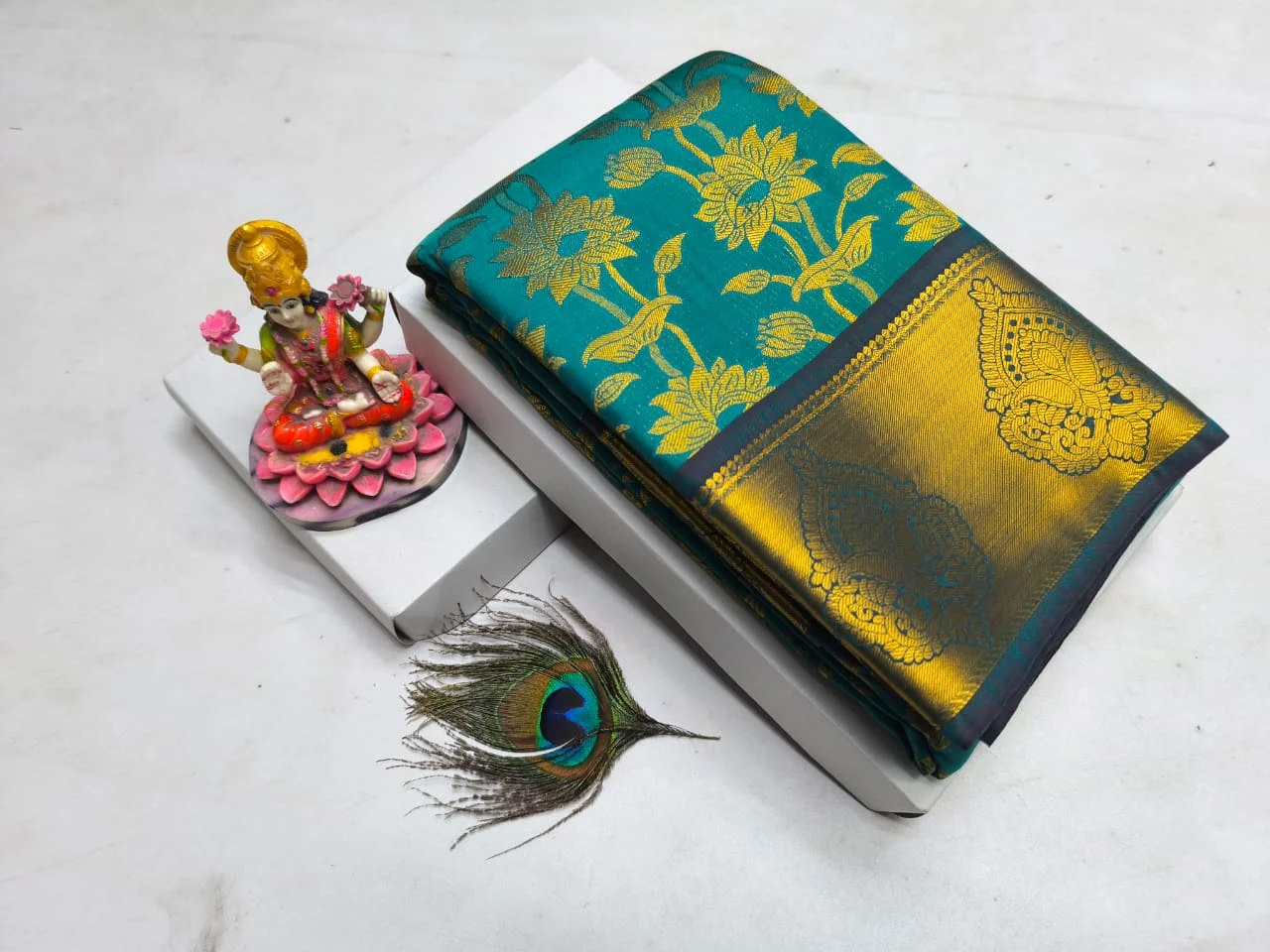 Teal Green Lotus Jaal Big Zari Border Kanchipuram Silk Saree